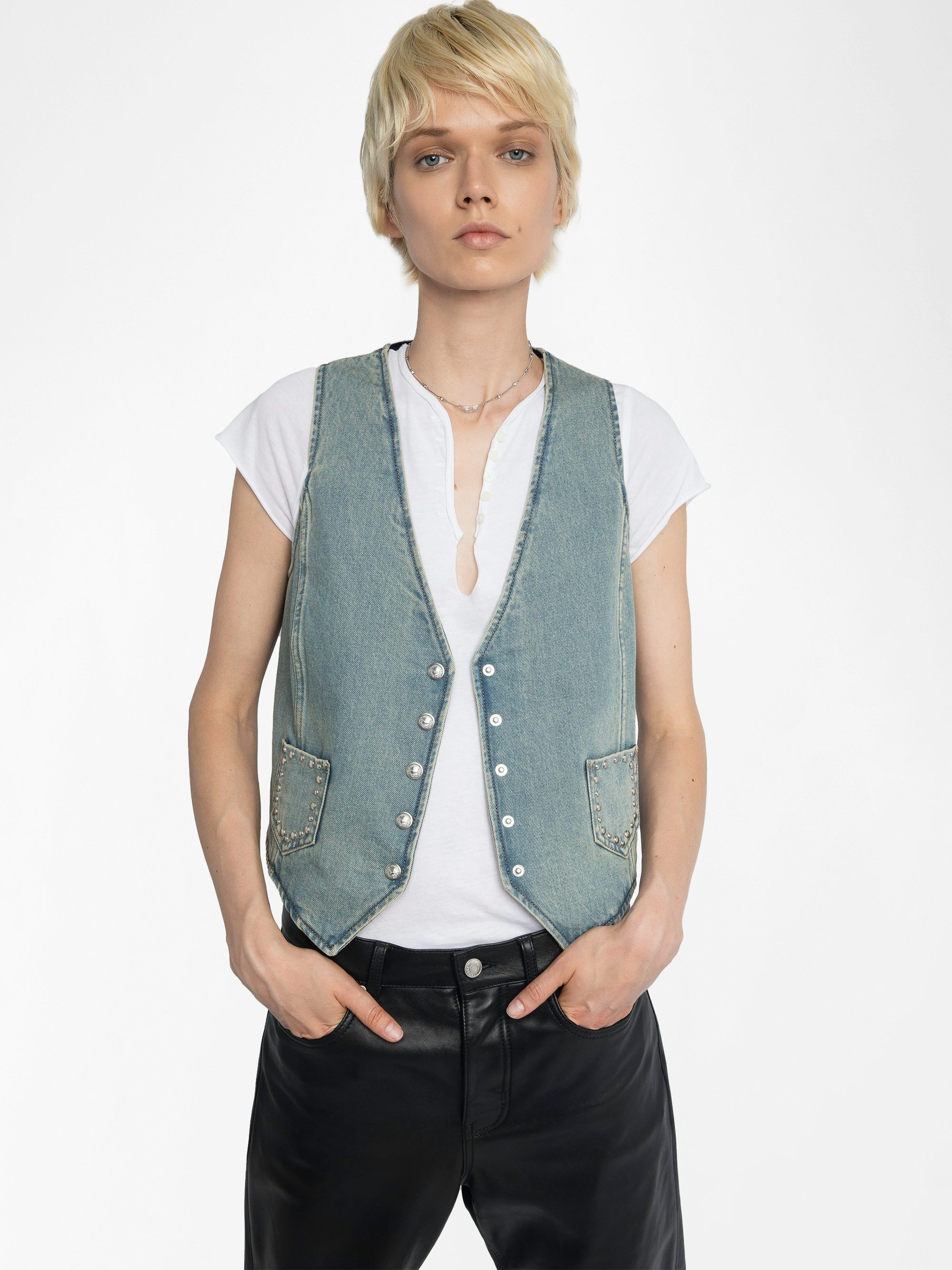 Gillier Denim Vest - This sleeveless denim vest is punctuated with silver studs and a raw edge finish—distressed just right. Layer it over everything, wear it like armor. Bold, free, undeniably Zadig.